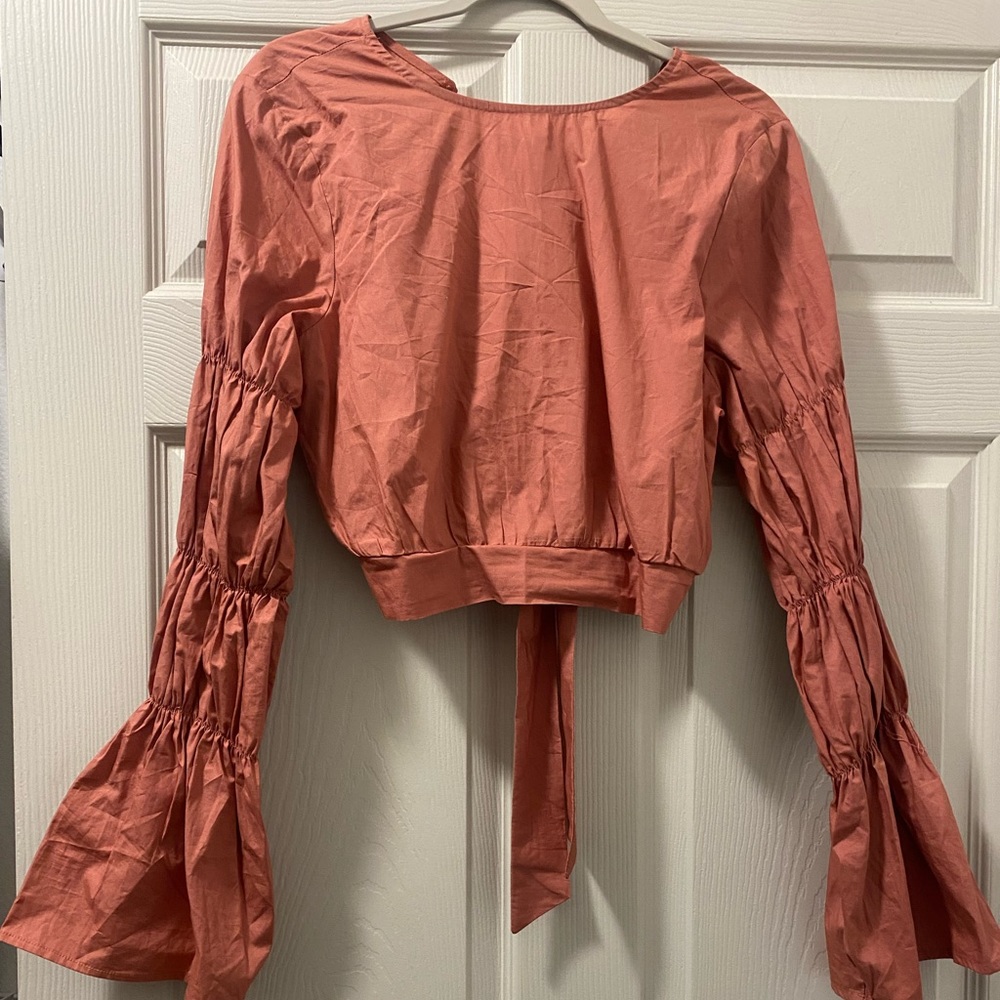 Medium open back ruffle long sleeve top